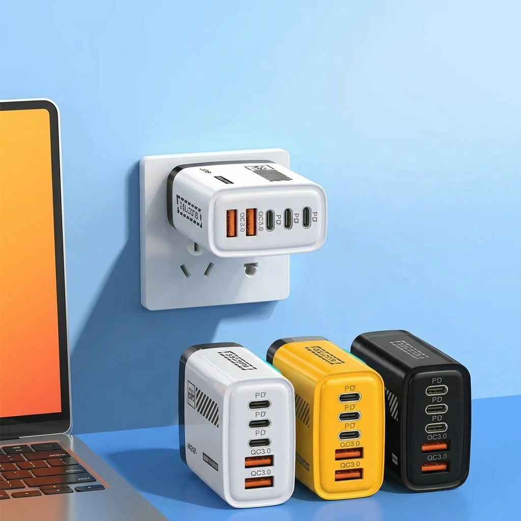 Wall adapter with multiple USB ports next to a laptop on a blue background