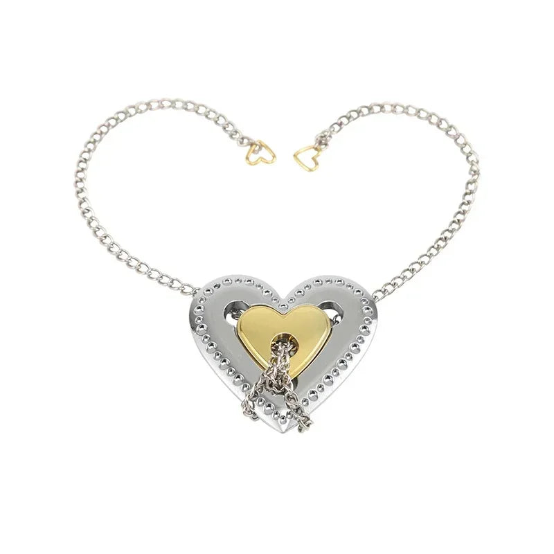 Heart-shaped necklace puzzle variant with gold and silver design on a white background