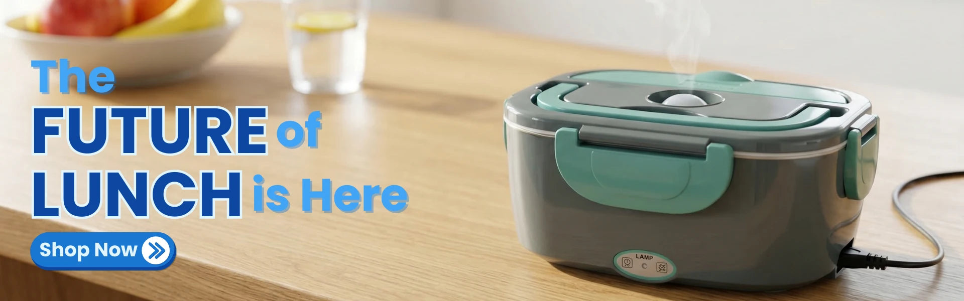 Banner image showing the gray electric lunch box product on a wooden kitchen counter with the headline text 'The Future of Lunch is Here.'
