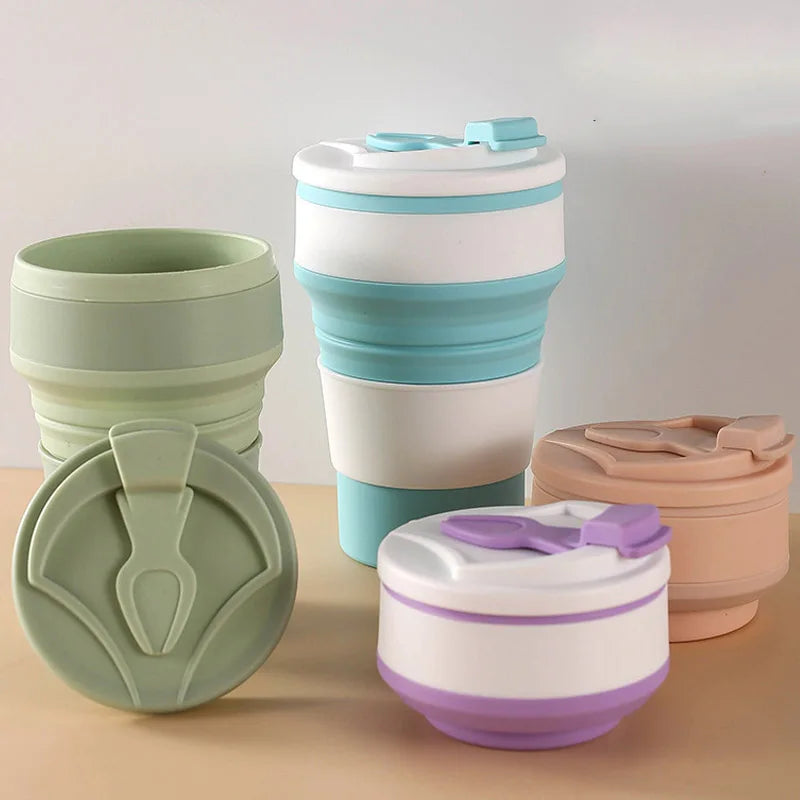 Set of collapsible travel cups in various colors on a neutral background