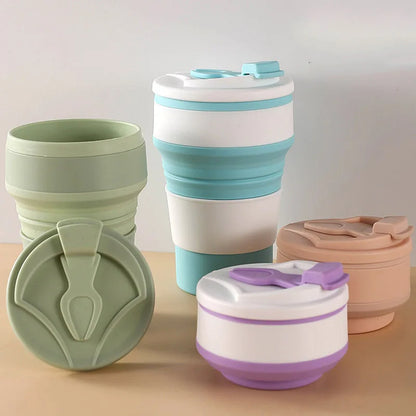 Set of collapsible travel cups in various colors on a neutral background