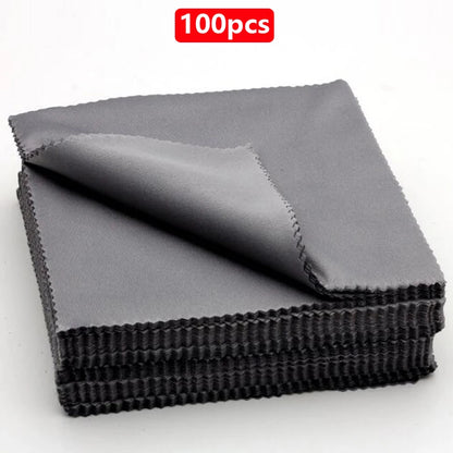 A single stack of black microfiber cleaning cloths with a red '100pcs' label on a white background