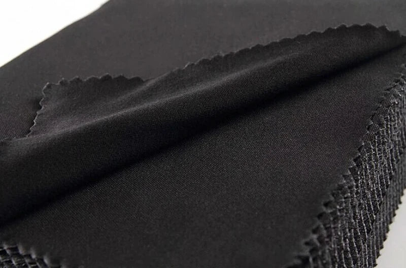 Close-up of black microfiber cleaning cloth with textured surface