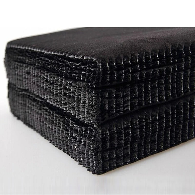 Stack of black glasses cleaning cloths on a white background