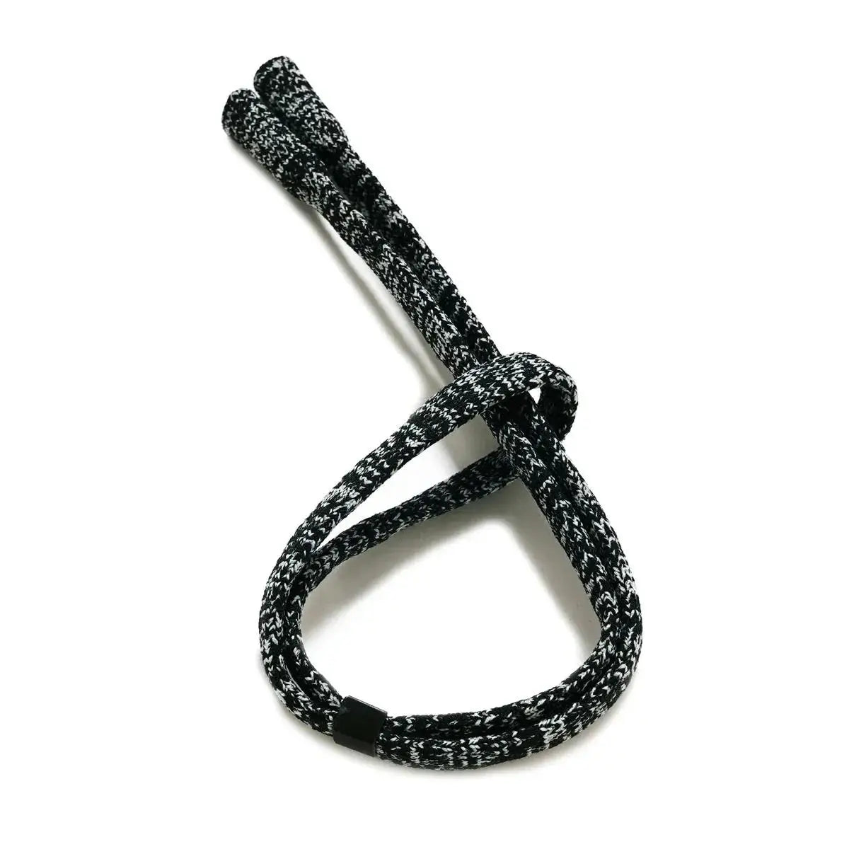 Black and White mix colored acrylic strap tied in a loose knot on a white background