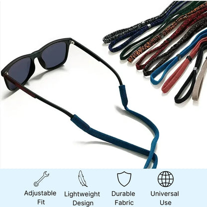Sunglasses with a black neck strap and additional straps in various colors on a white background.