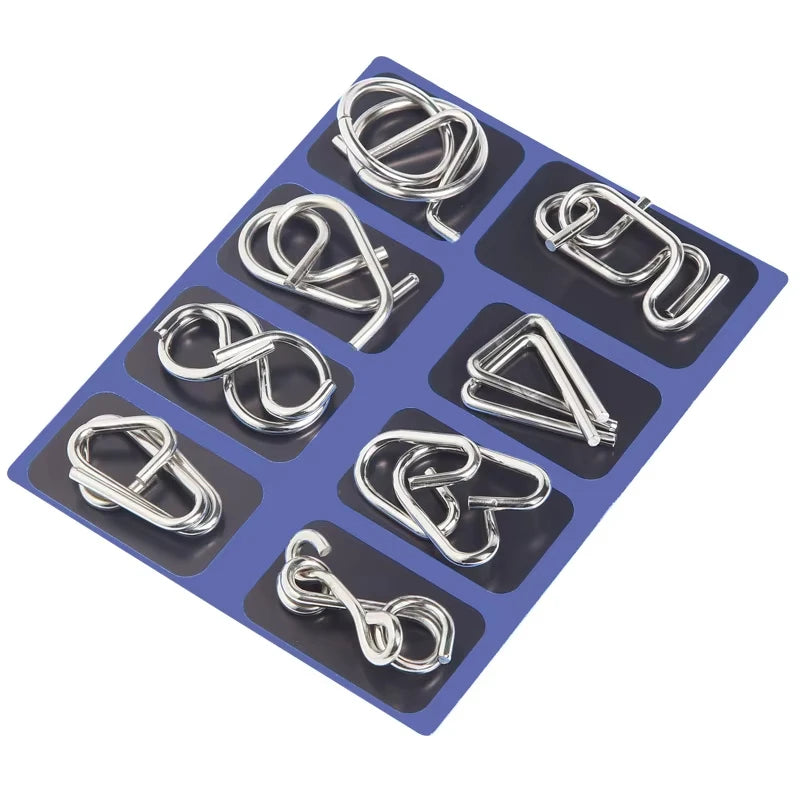 Set of 8 metal wire puzzles on a dark blue tray with black squares.