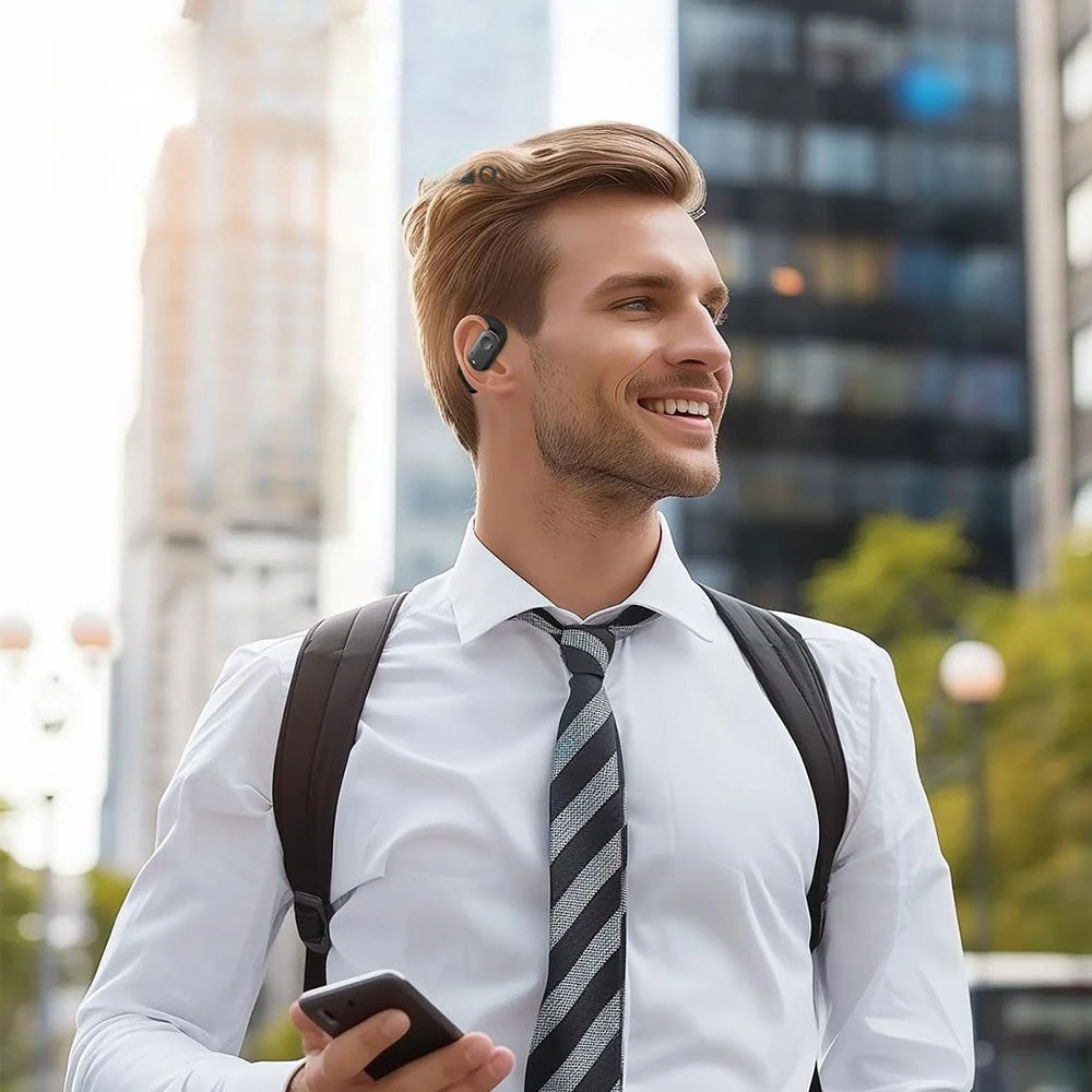 Man wearing a white shirt, black tie, and carrying a backpack in an urban setting.