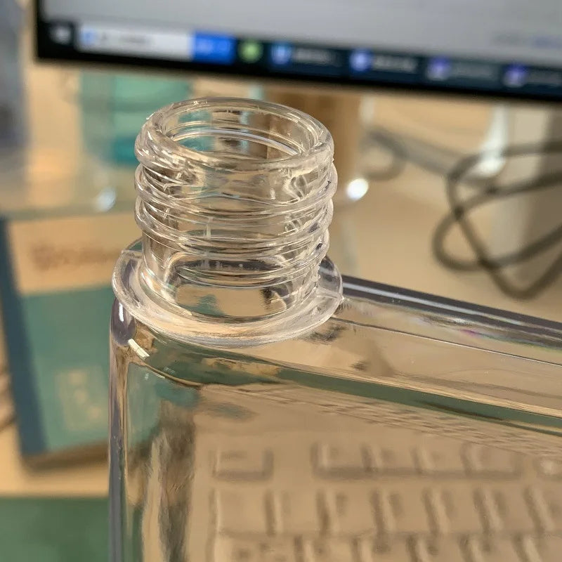 Clear glass bottle with a blurred background