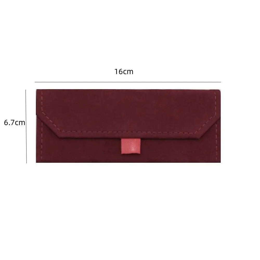 A red triangular glasses case with dimensions labeled on a white background