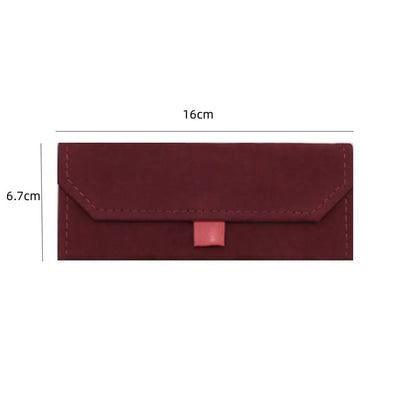 A red triangular glasses case with dimensions labeled on a white background