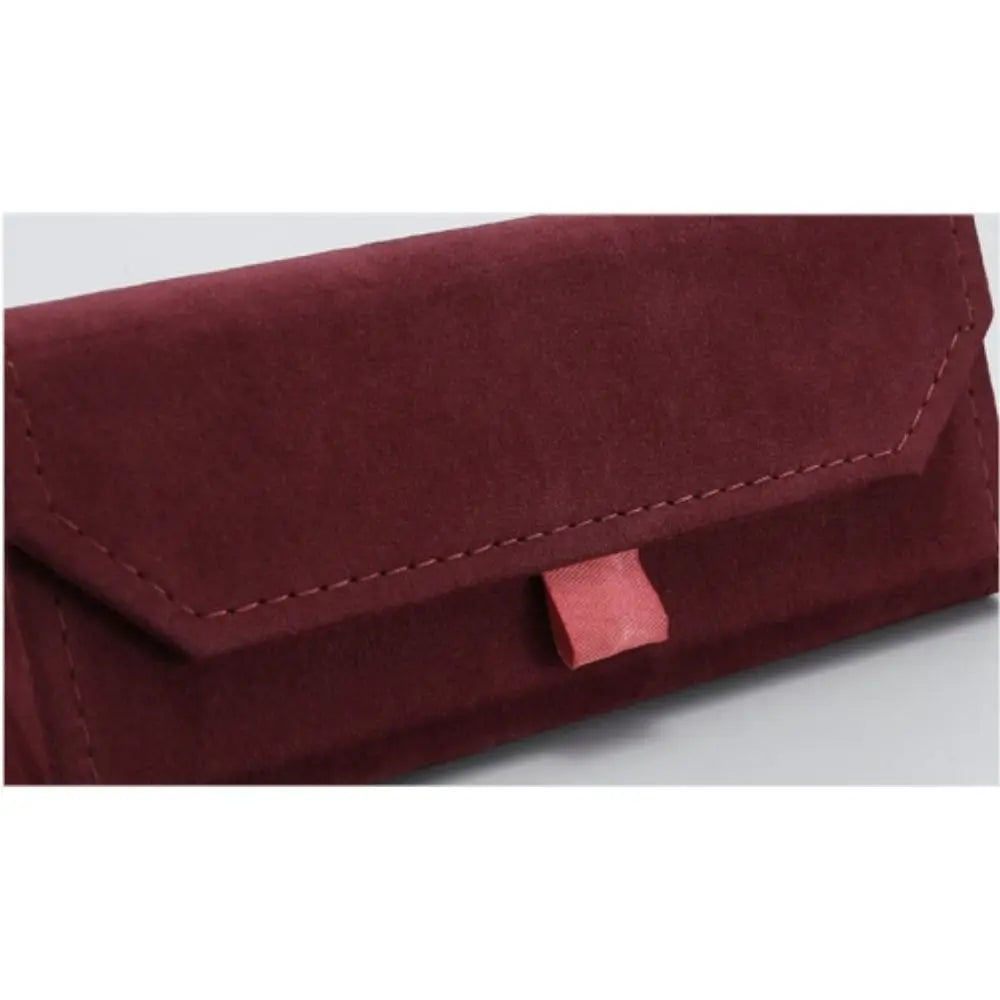 Close up of a red triangular glasses case on a white background