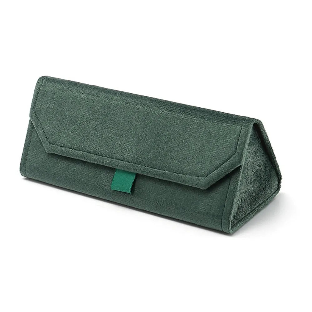 Green triangular velvet eyewear case on a white background