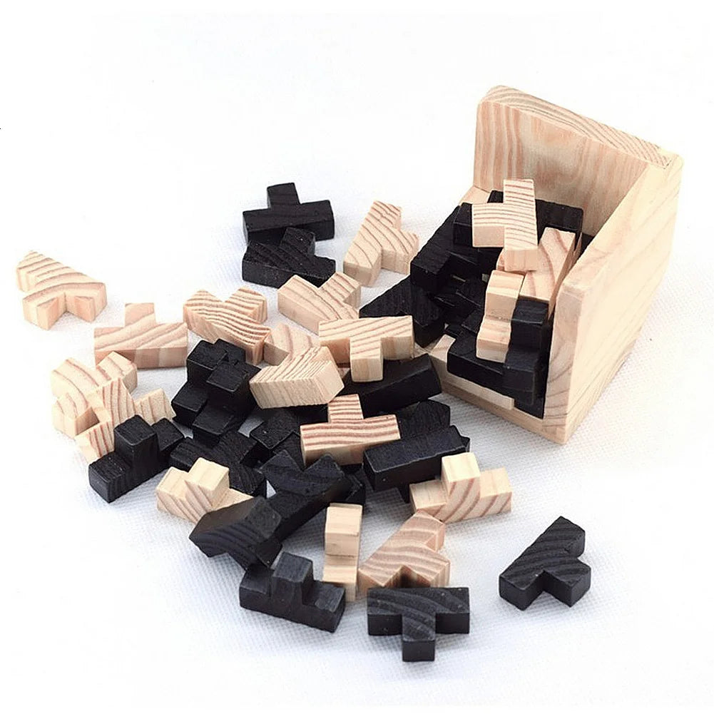 Wooden 3d cube puzzle T-shaped pieces scattered on a white surface