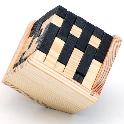 Wooden 3d cube puzzle with black and natural wood pieces on a white background