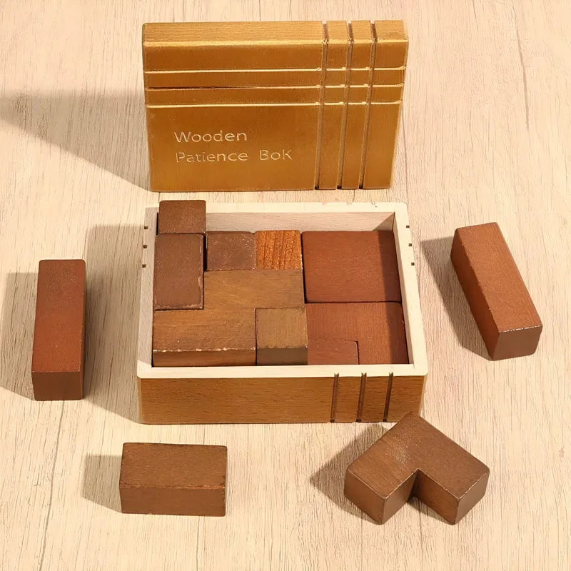 The Wooden Patience Box variant displayed on a light wood surface. The box is open and several loose blocks arranged around it.