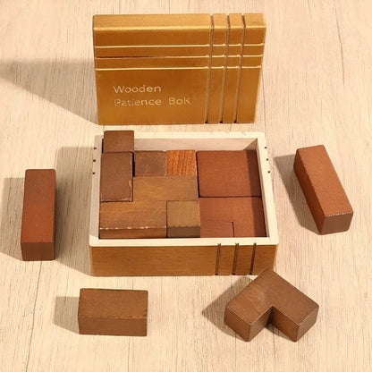 The Wooden Patience Box variant displayed on a light wood surface. The box is open and several loose blocks arranged around it.
