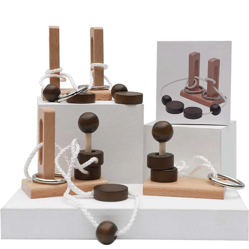 Assorted variants of the wooden rope untie puzzle on a white base against a white background.