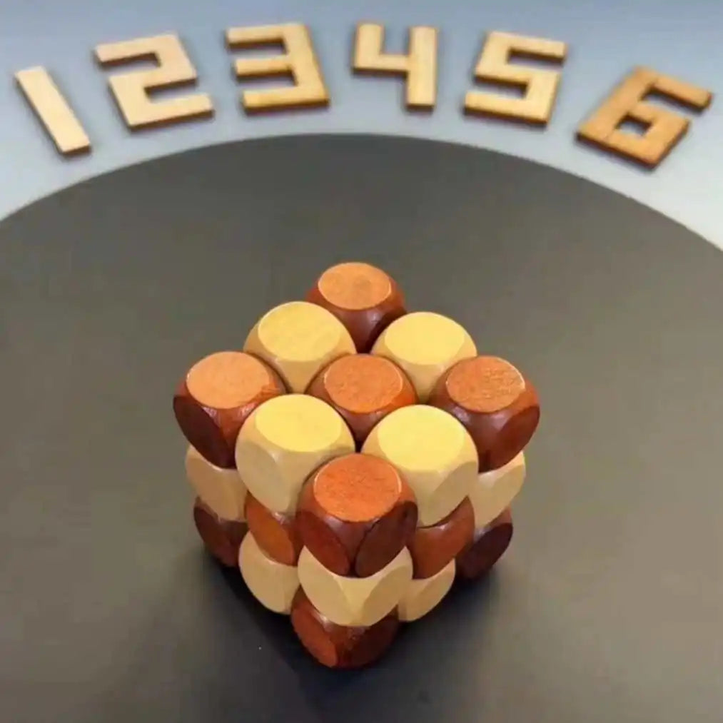 Wooden twisting cube puzzle in its cube shape on a dark background.