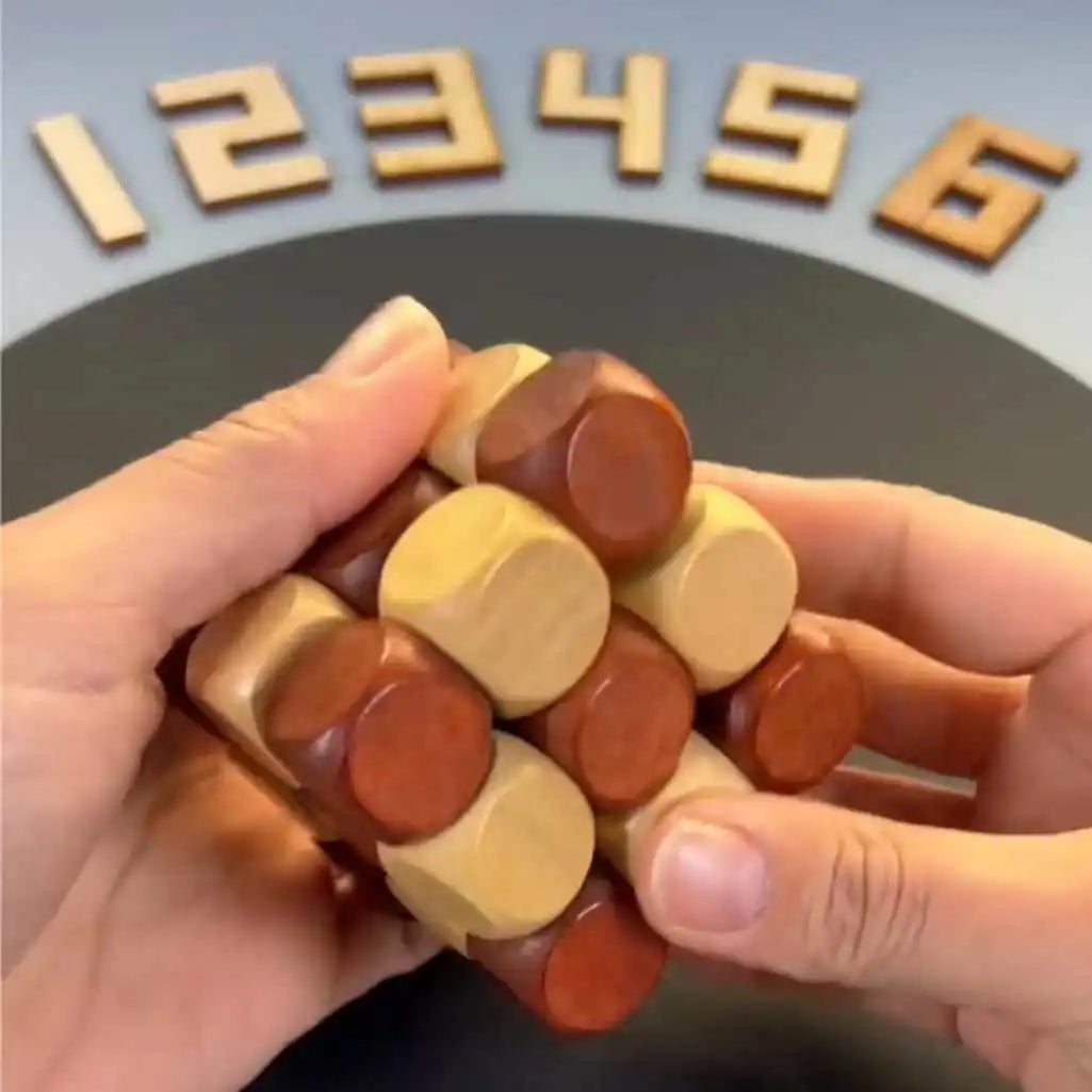 Hand holding the wooden twist cube puzzle.
